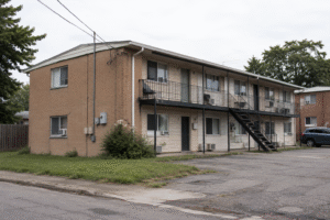 Older small multifamily apartment property in a modest neighbourhood