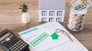 Real estate analyst reviewing a multifamily underwriting model at a desk.